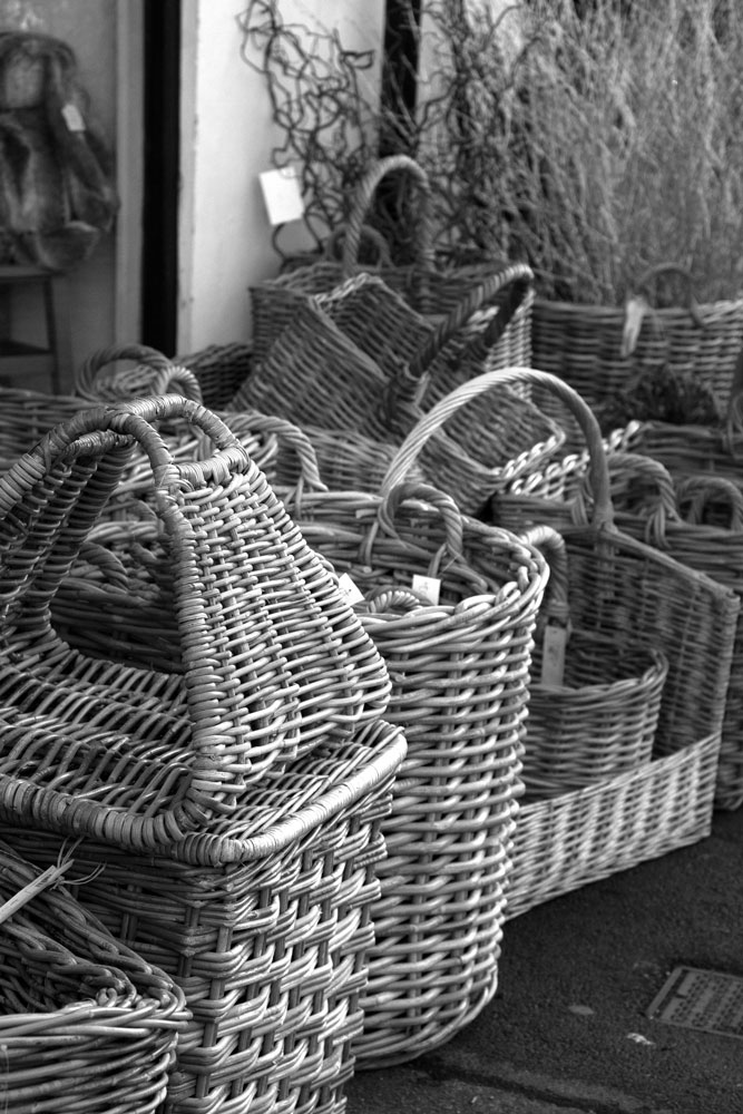 Wicker baskets on the street outside a high street shop